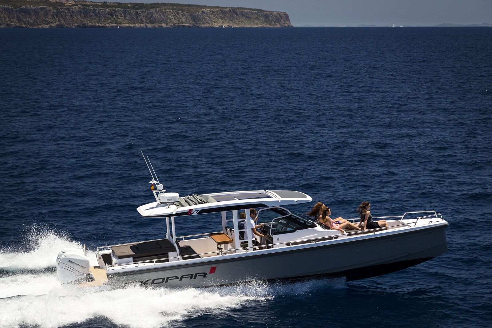 Axopar 37 charter boat with guests enjoying luxury day trip from Puerto Portals