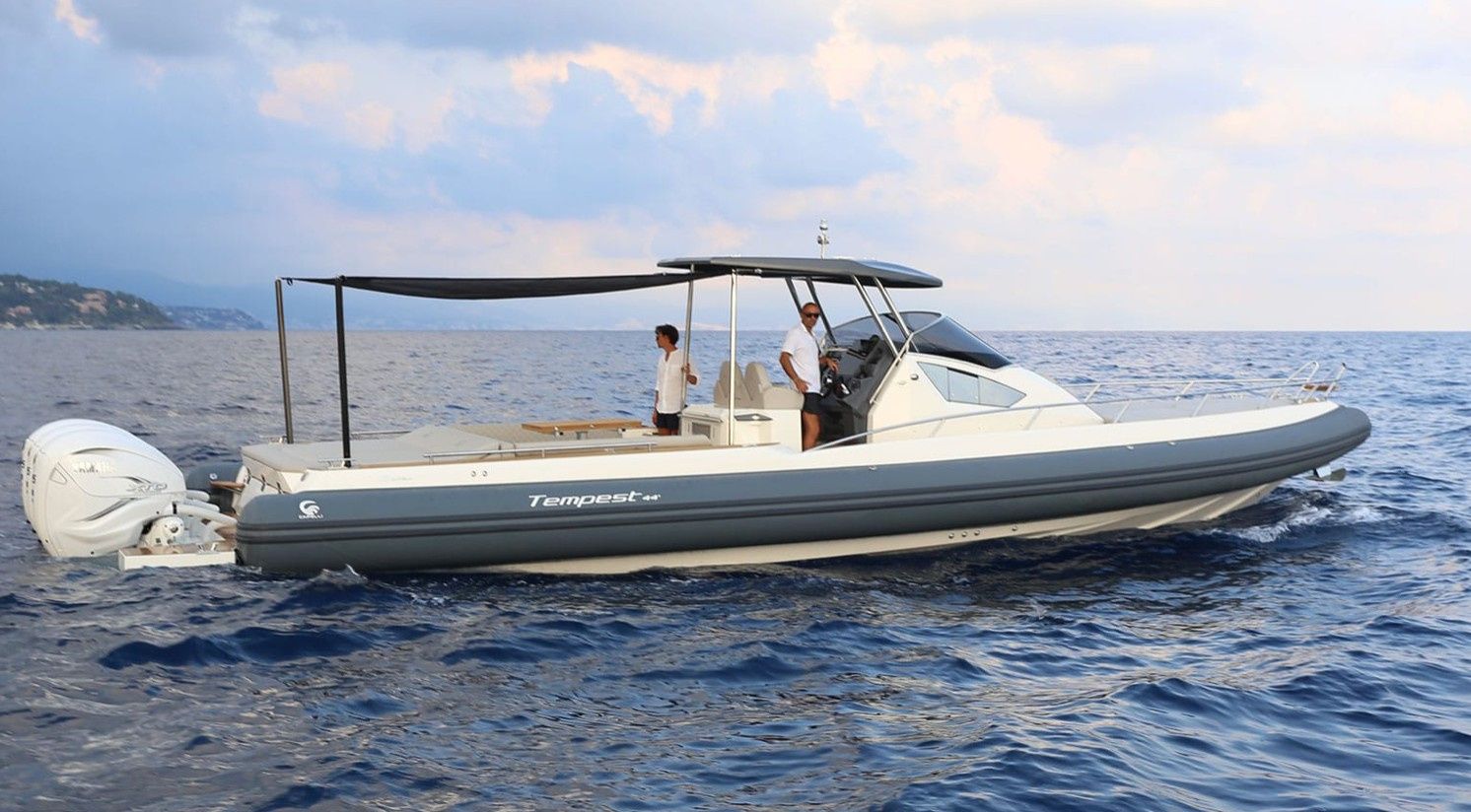 Tempest 44 boat side profile at sunset from Puerto Portals